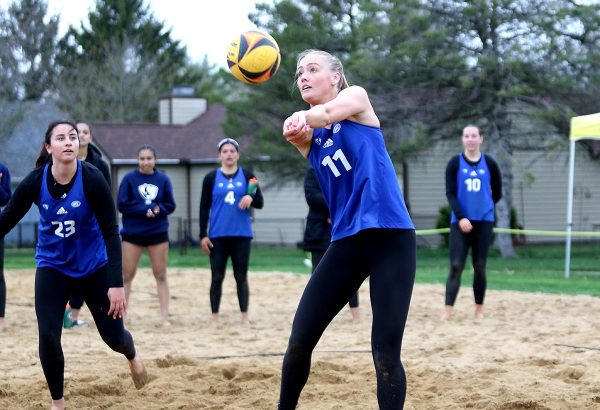 Junior Sylvia Hasz (left) and senior Kaitlyn Flynn (right) compete in a beach volleyball match against the Lindenwood Lions on Wednesday, April 10, 2024 at Sister City Park in Charleston, ILL