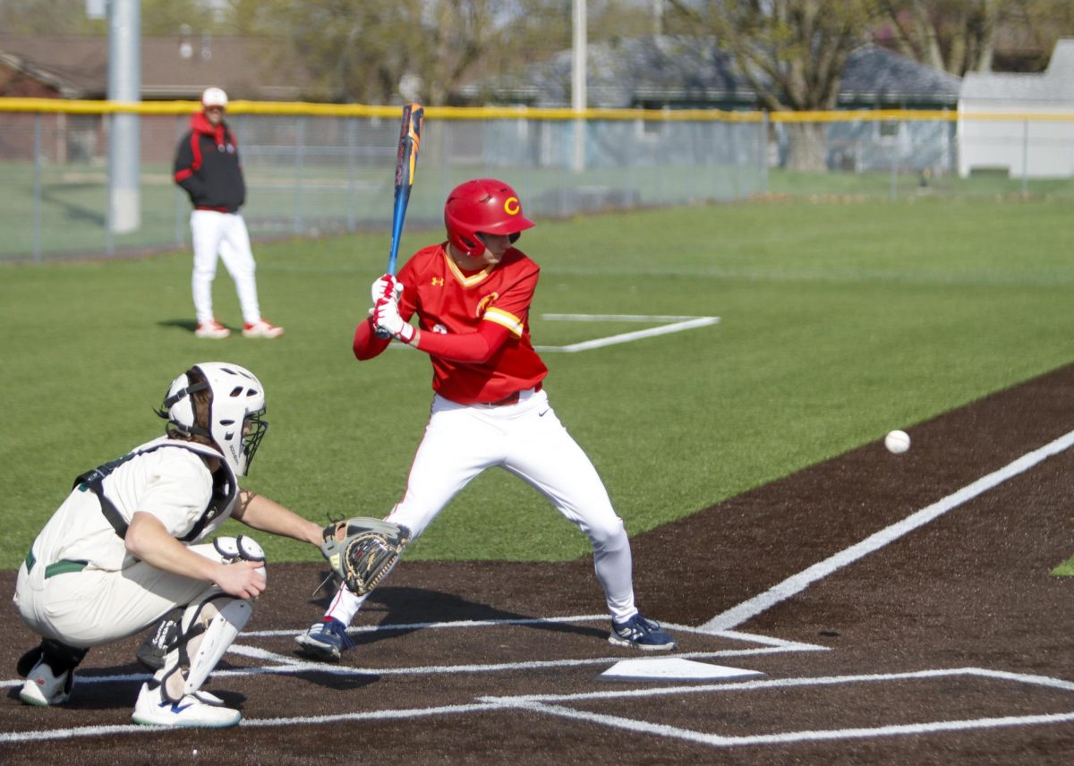  Charleston High School senior Luke Bonnstetter watching a ball come into the plate during game one of the Trojans' doubleheader against the Mattoon Greenwave as Charleston lost both games 12-8 and 5-4 on Monday April 7.