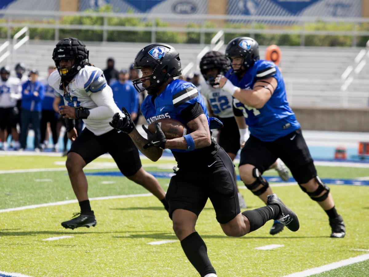 Eastern Illinois football redshirt junior running back Jay Pearson running down the middle of the field during Eastern’s spring game as the offense beat the defense 43-42 at O’Brien field on Saturday.