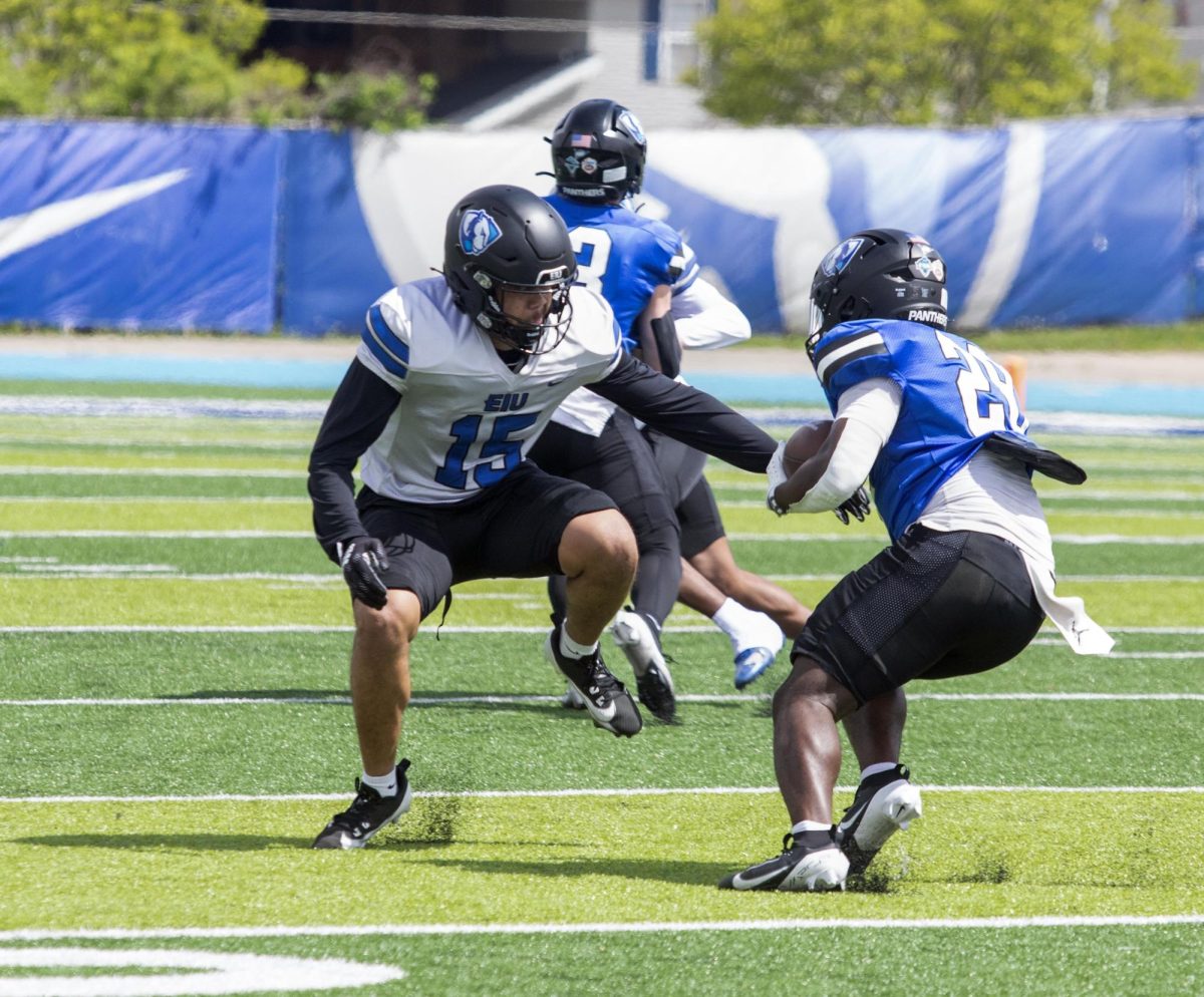  Eastern Illinois football redshirt freshman running back Jacarre Fleming making the defender miss in the middle of the field during Eastern’s spring game as the offense beat the defense 43-42 at O’Brien field on Saturday.