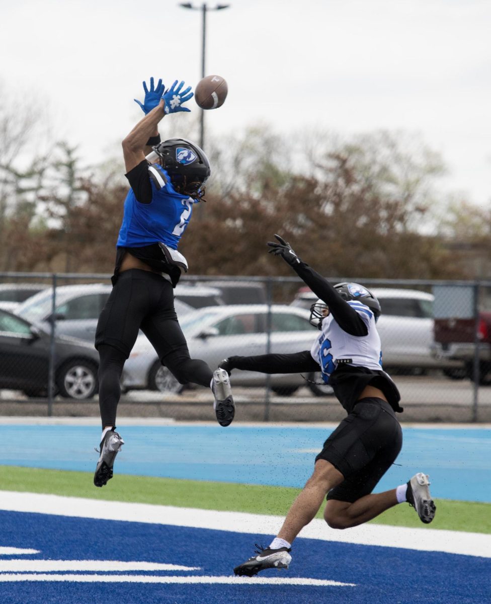 Eastern Illinois football redshirt junior wide receiver CJ Nelson jumping in the air to try and catch a ball in the endzone during Eastern’s spring game as the offense beat the defense 43-42 at O’Brien field on Saturday.
