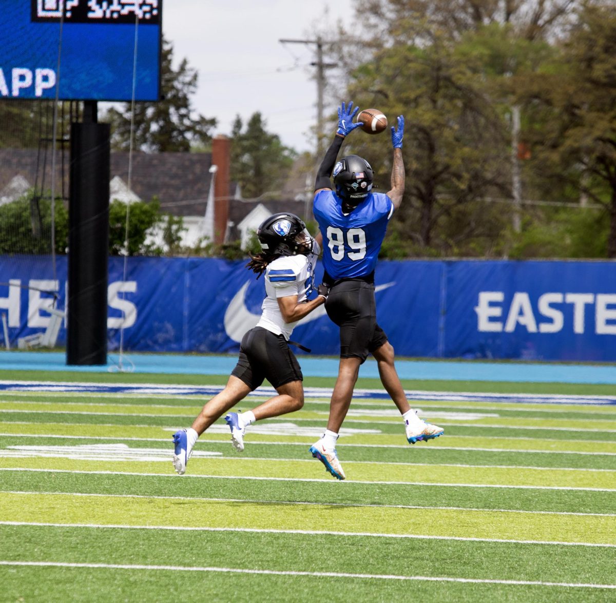 Eastern Illinois football redshirt freshman wide receiver Kenny Ajose jumping in the air to catch the ball down the right sideline during Eastern’s spring game as the offense beat the defense 43-42 at O’Brien field on Saturday.