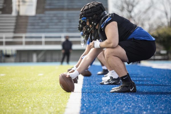 Redshirt sophomore offensive lineman, Panayiotis Mihalopoulos, lines up with the offensive line with the ball to throw it back during football practice at O'Brien Field on April 10.
