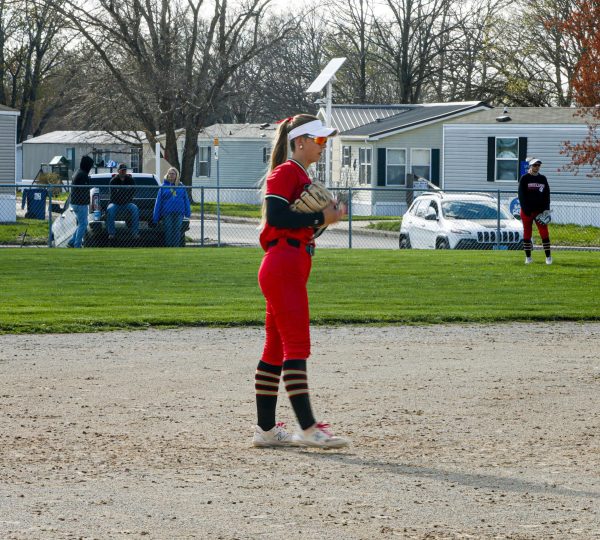 Charleston High School senior Blair Ritchey awaits the pitch while playing shortstop during game one of the Trojans' doubleheader against Mattoon Tuesday at Neco Field in Charleston, Illinois.
