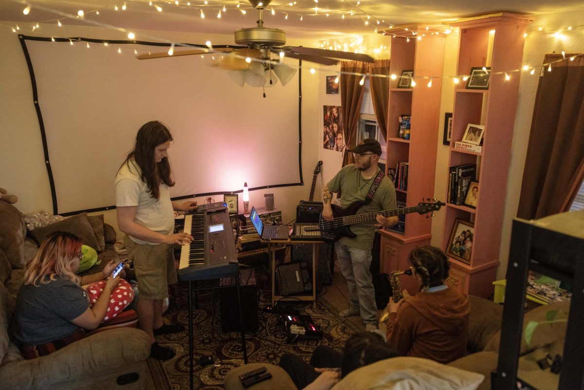 Members of Insomniacs Dream practice parts of the group's Springfest set list Friday evening. Several of the music collective members graduated from EIU.  