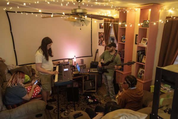 Members of Insomniacs Dream practice parts of the group's Springfest set list Friday evening. Several of the music collective members graduated from EIU.  