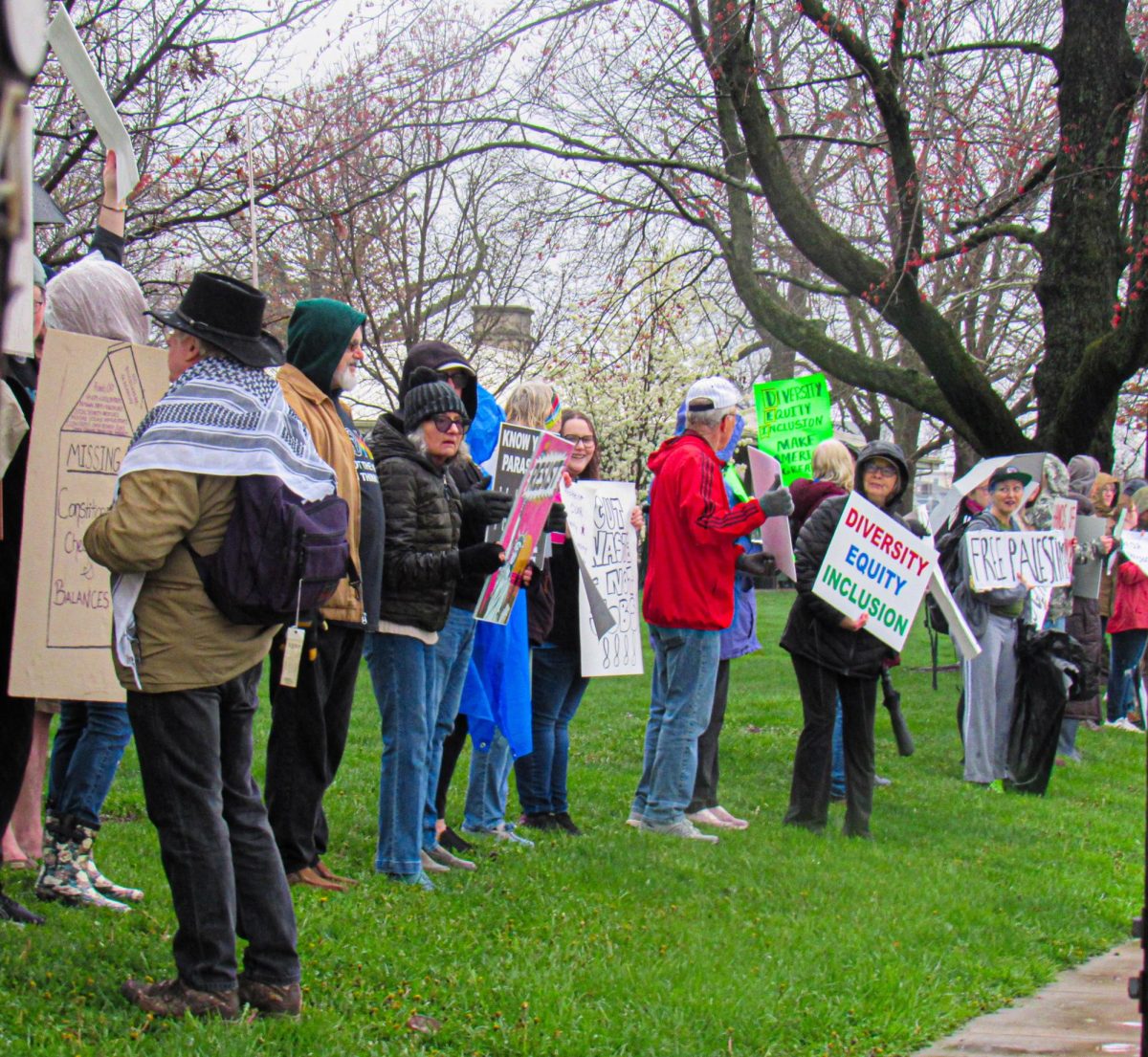 Protesters participating in the Hands Off! Mobilization at the edge of Morton Park along Lincoin Avenue on Saturday. Hands Off! is a movement centered around country wide protesting on April fifth of President Donald Trump and Department of Government Efficiency head Elon Musk's actions in the federal government.