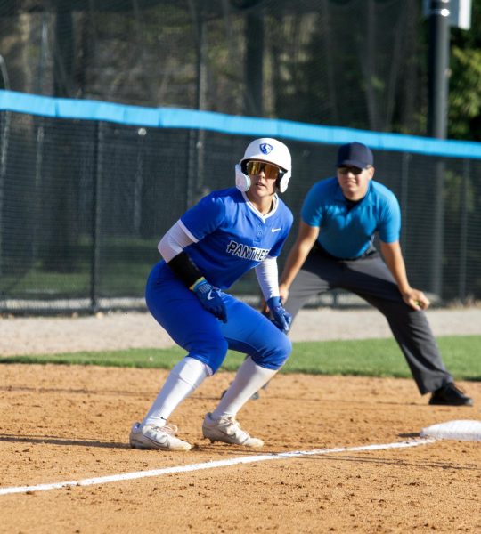 Eastern Illinois softball freshman outfielder Morgan Hance on third base getting ready to run to home plate at Williams field during Eastern’s win against Indiana State University 8-0 in six innings on Tuesday.