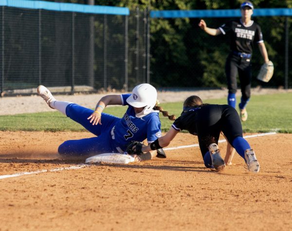 Eastern Illinois softball senior infielder Briana Gonzalez sliding into third base after hitting a leadoff triple in the bottom of the fifth inning at Williams field during Eastern’s win against Indiana State University 8-0 in six innings on Tuesday.