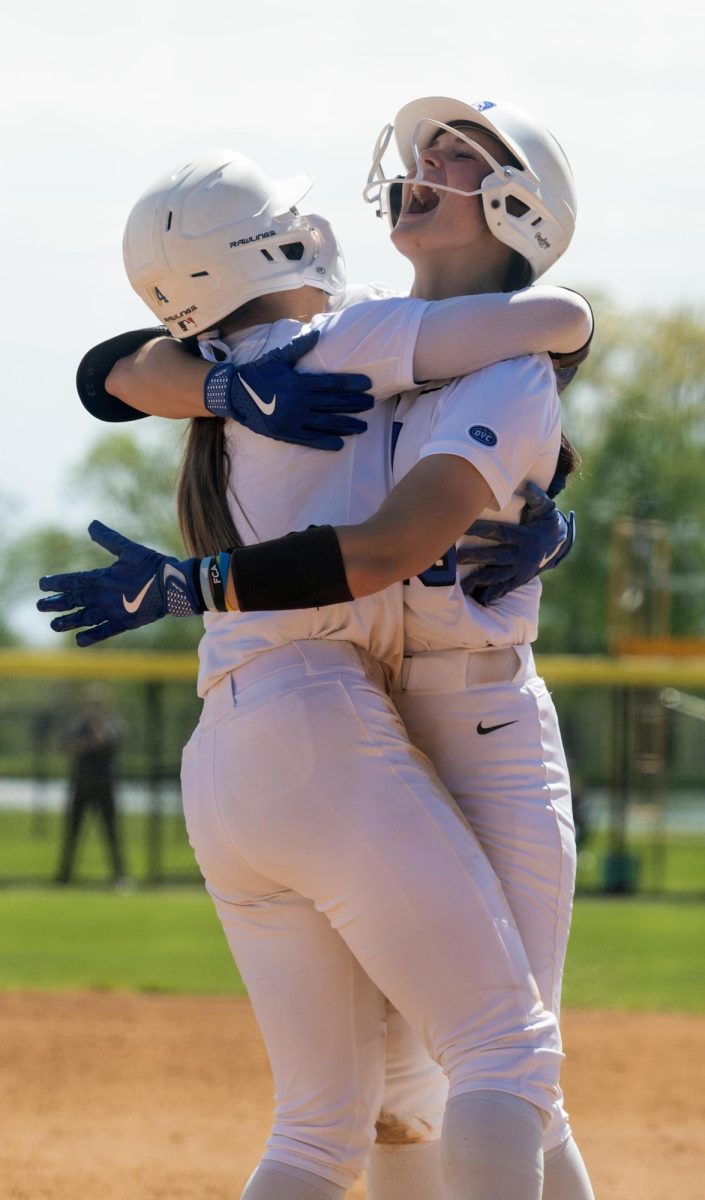 Eastern Illinois softball freshman utility player Abbi Hatton (right) and freshman outfielder Morgan Hance (left) hugging each other after a walk off hit during the first game of Eastern’s double header against Southern Illinois University Edwardsville at Williams field on Sunday.