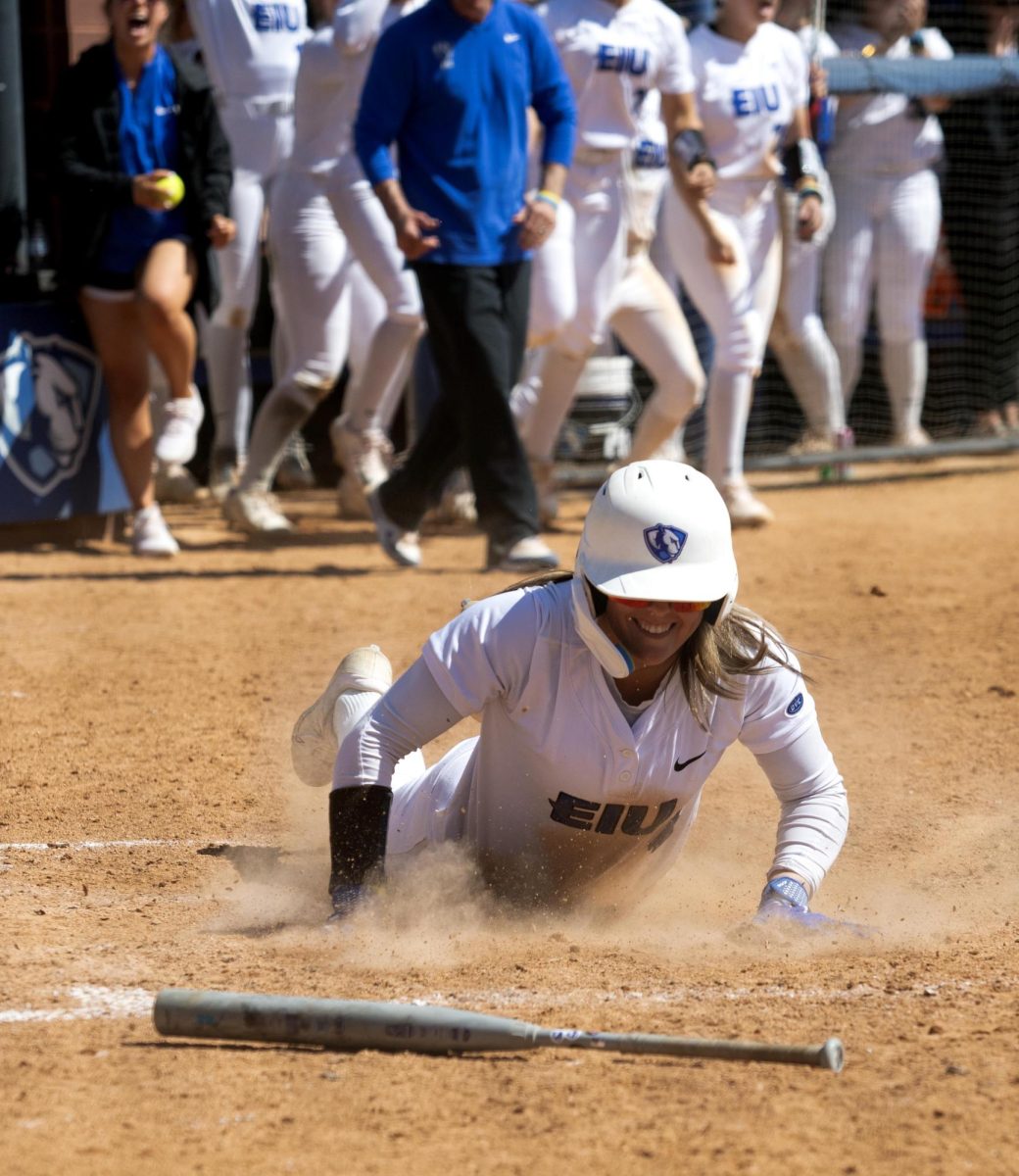 Eastern Illinois softball freshman outfielder Morgan Hance sliding into home plate to win the game during the first game of Eastern’s double header against Southern Illinois University Edwardsville at Williams field on Sunday.