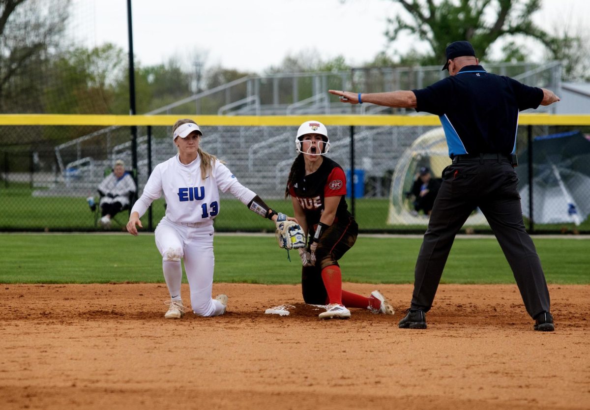 Eastern Illinois softball sophomore infielder Alisha Frederick attempting to catch the runner at second base during the first game of Eastern’s double header against Southern Illinois University Edwardsville at Williams field on Sunday.