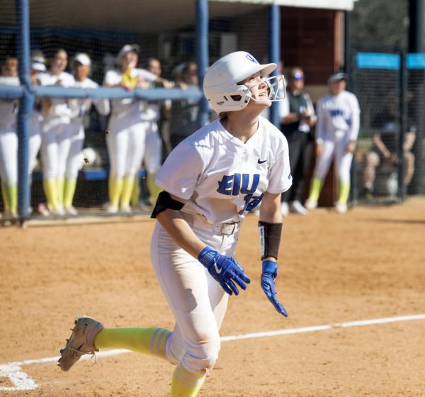 Eastern Illinois sophomore infielder Alisha Frederick looking up at her ball as it goes over the home run fence in the third inning during its annual care game and Eastern’s win against Southern Indiana 5-2 at Williams field on Saturday April 12.