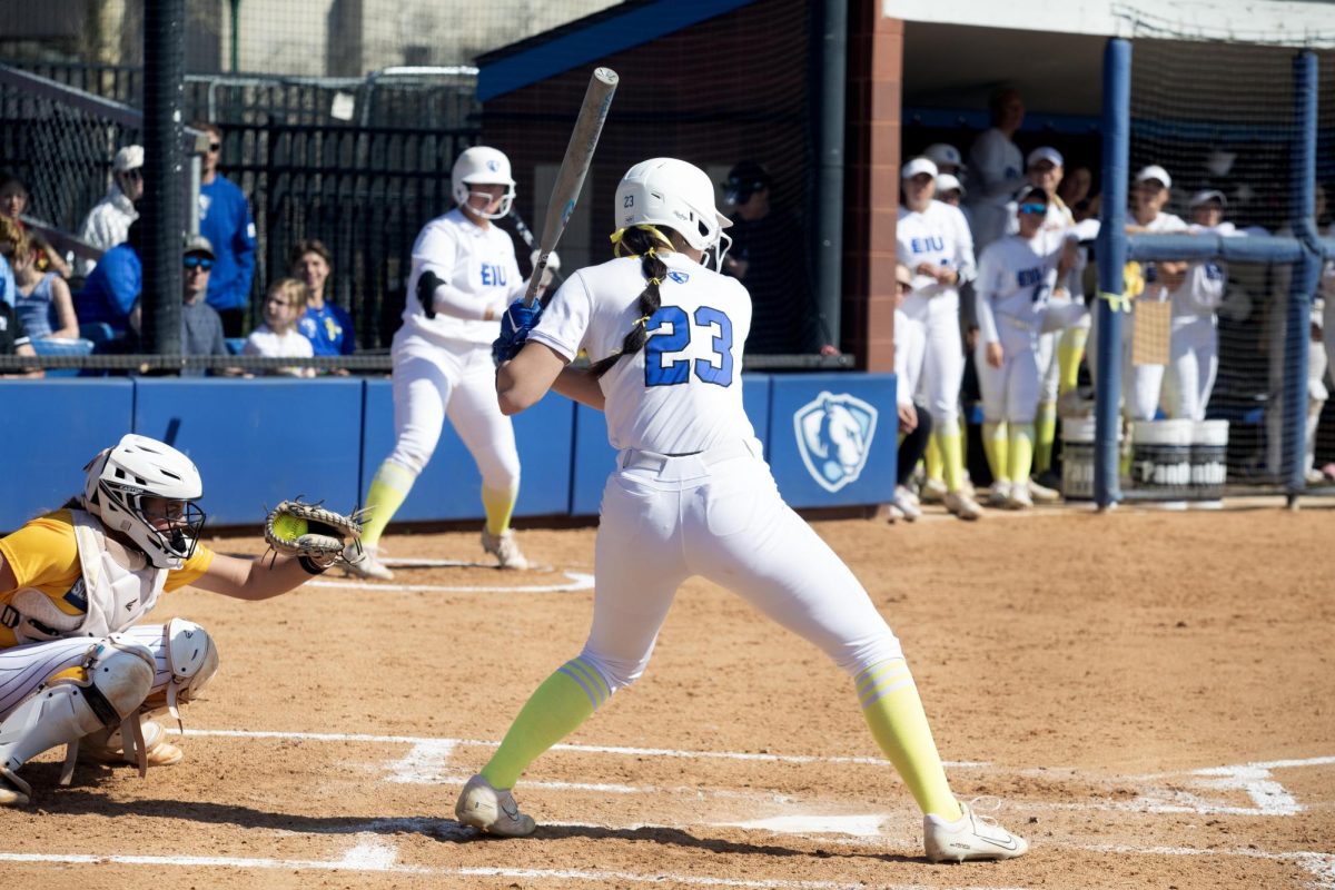 Eastern Illinois softball freshman utility player Abbi Hatton getting ready to hit the ball in the batter's box while her and her teammates are wearing yellow bows and socks for the Eastern care game for Sarcoma during Eastern’s win against Southern Indiana 5-2 at Williams field on Saturday April 12.