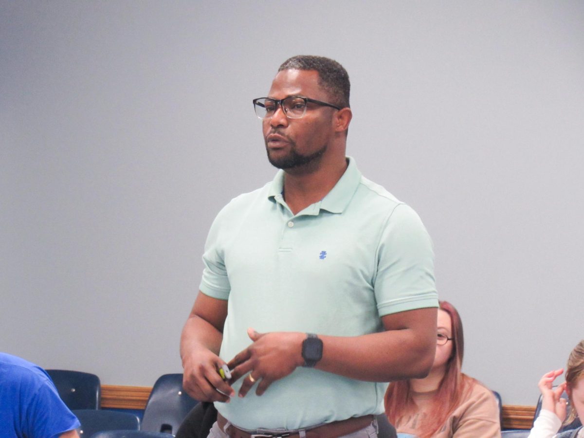 Ghanian Student Association representative Isaiah Adegoke speaks to the Eastern Illinois University student senate meeting in the Arcola-Tuscola room at the Martin Luther King Jr student union on Wednesday April 9.