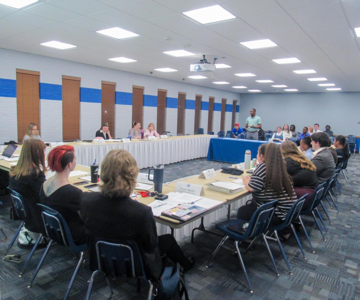 Ghanian Student Association representative Isaiah Adegoke speaks to the Eastern Illinois University student senate meeting in the Arcola-Tuscola room at the Martin Luther King Jr student union on Wednesday April 9.