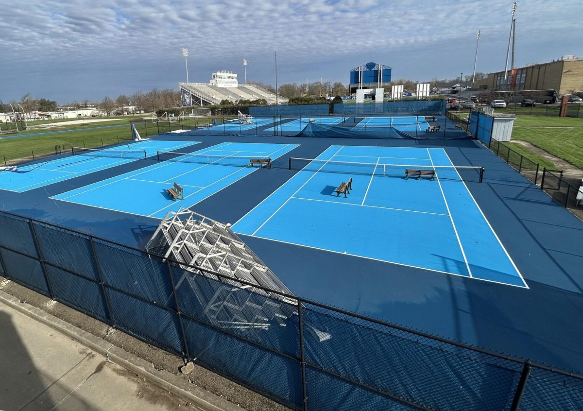 Following a rough thunderstorm the day before, a set of bleachers was flipped and dragged across the tennis court alongside several benches. Tarps in between courts were torn down across the court on April 3.