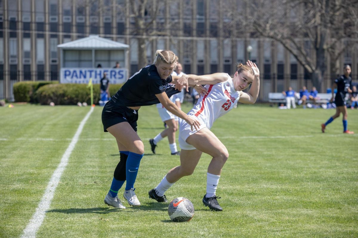 Eastern Illinois women’s soccer senior midfielder Avery Richardson pushing Illinois State senior defender Abby Hall away from the soccer ball during Eastern’s lost to Illinois State 1-0 at its spring game at Lakeside field on April 12, 2025., on the Eastern Illinois University campus. Charleston ILL. 
